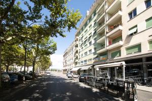 an empty street in front of a building at Primadom Aparthotel in Geneva