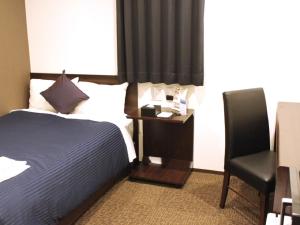 Voodi või voodid majutusasutuse HOTEL LiVEMAX Meieki toas