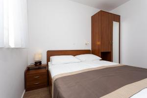 Posteľ alebo postele v izbe v ubytovaní Apartments Crneković V
