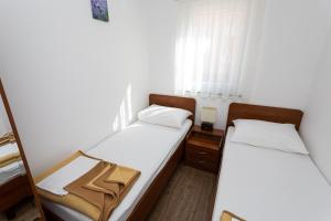Posteľ alebo postele v izbe v ubytovaní Apartments Crneković V