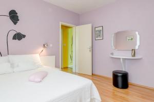 Postel nebo postele na pokoji v ubytování Apartman Petra 5