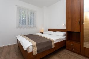 Posteľ alebo postele v izbe v ubytovaní Apartments Crneković V
