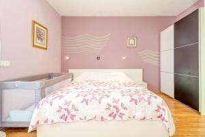 Postel nebo postele na pokoji v ubytování Apartman Petra 5