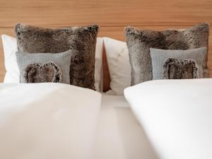 Postel nebo postele na pokoji v ubytování Alpen-Comfort-Hotel Central