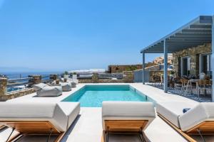 a villa with a swimming pool with a view at Roca Bonita villa in Elia Beach