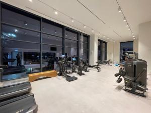 a gym with treadmills and exercise equipment in a building at Luxury Appartment Belgrade Waterfront in Belgrade