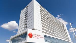 a tall white building with a sign on it at PINK & GREEN APARTMENTS - RHO FIERA MILANO MIND - Andrea in Rho