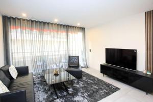 Televízia a/alebo spoločenská miestnosť v ubytovaní Appartement avec balcon Supercroisette