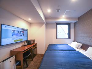 Posteľ alebo postele v izbe v ubytovaní HOTEL LiVEMAX Nihonbashi Koamicho