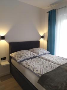 Posteľ alebo postele v izbe v ubytovaní Apartament Lenka