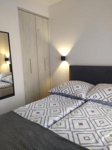 Posteľ alebo postele v izbe v ubytovaní Apartament Lenka