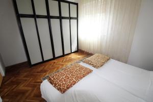 Postel nebo postele na pokoji v ubytování Apartman Moro
