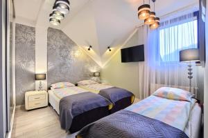 Posteľ alebo postele v izbe v ubytovaní Art Apartament Krynica Zdrój Centrum