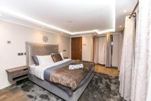 a bedroom with a large bed in a room at 41 Haven in Nairobi