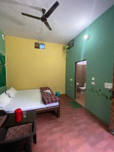 A bed or beds in a room at Breeze Arise Homestay By WB Inn