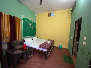 A bed or beds in a room at Breeze Arise Homestay By WB Inn
