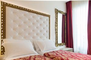 Postel nebo postele na pokoji v ubytování Hotel Lido