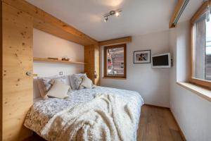 Ένα ή περισσότερα κρεβάτια σε δωμάτιο στο Luxurious Chalet in Verbier