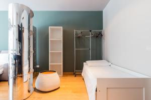 a small bedroom with a bed and a shower at Milan Retreats Brera in Milan +108 photos