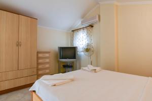 Postel nebo postele na pokoji v ubytování SUNSET BEACH CLUB LEBRENTALS