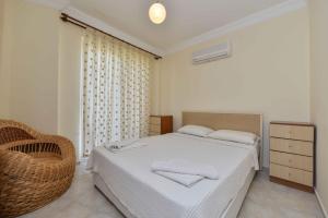 Postel nebo postele na pokoji v ubytování SUNSET BEACH CLUB LEBRENTALS