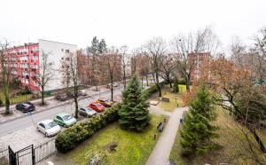 an aerial view of a city with cars parked in a park at Żoliborz Elite Apartment in Warsaw