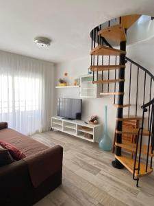 TV a/nebo společenská místnost v ubytování VicAm Atico Duplex