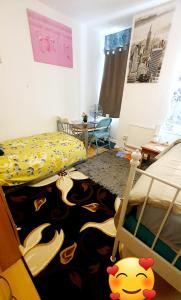 a bedroom with a bed and a monkey rug on the floor at Comfortable Host, in zone 2-3 in London