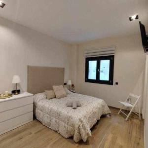 Łóżko lub łóżka w pokoju w obiekcie Estupendo Piso Nuevo en Playa Victoria