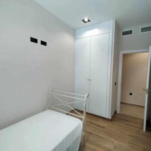 Łóżko lub łóżka w pokoju w obiekcie Estupendo Piso Nuevo en Playa Victoria