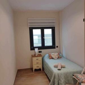 Łóżko lub łóżka w pokoju w obiekcie Estupendo Piso Nuevo en Playa Victoria