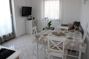TV a/nebo společenská místnost v ubytování Apartment Una