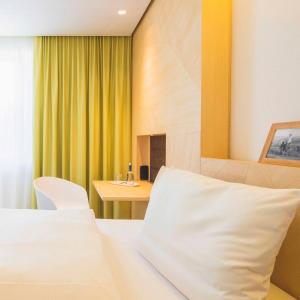 Postel nebo postele na pokoji v ubytování Hotel Luise + 37 fotografií
