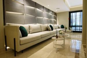 a living room with a couch and a table at SuMa Recoleta Hotel in Buenos Aires