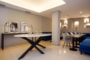 a dining room with a table and chairs at SuMa Recoleta Hotel in Buenos Aires +54 photos
