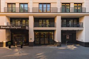 a building with a bunch of doors and windows at Barceló Budapest in Budapest