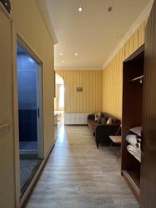 a hallway with a couch and a living room at MARJANI apartments in Tbilisi City