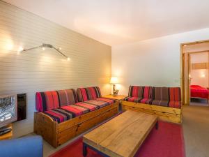 a living room with two couches and a table at Appartement Val-d'Isère, 5 pièces, 8 personnes - FR-1-694-151 in Val-d'Isère