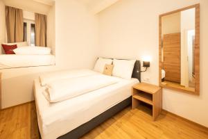 Rúm í herbergi á Kuckuck Hinterthal - Appartements