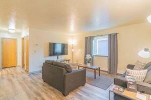 a living room with a couch and a tv at Centrally Located Comfort And Coffee 3 in Fairbanks