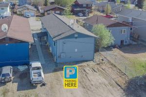 a parking here sign in front of a blue house at Centrally Located Comfort And Coffee 3 in Fairbanks