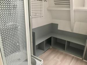 a bathroom with a shower and a walk in closet at Chalet 46 Casa Fantasia in Durbuy