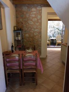 a dining room with a table and chairs in a room at Ca na Francina in Valldemossa
