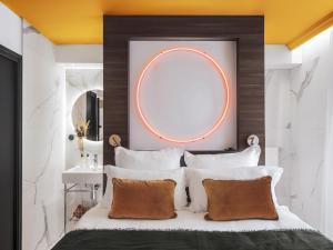 a bedroom with a large mirror above a bed at Seven Hotel in Paris