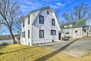a white house with a gambrel roof at Charming Elmsford Home about 23 Mi to Manhattan! in Elmsford