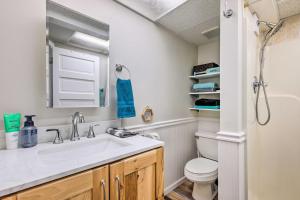 a bathroom with a sink and a toilet at Lakefront Mercer Home Private Dock and Kayaks! in Mercer +22 photos