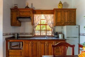 A kitchen or kitchenette at Sea view villa in Tijarafe, private pool.