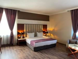 Postel nebo postele na pokoji v ubytování Ramada by Wyndham Plovdiv Trimontium