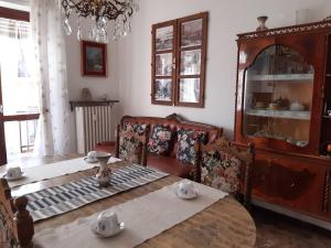 a room with a table and a chair and a dining room at Giaveno, apartment "margherita" a pochi passi dal centro, wifi in Giaveno
