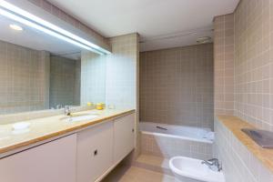 a bathroom with a sink and a mirror at Marina Lovers by Seewest in Lagos +31 photos